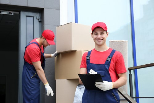 Loading furniture into a van near Hammersmith streets