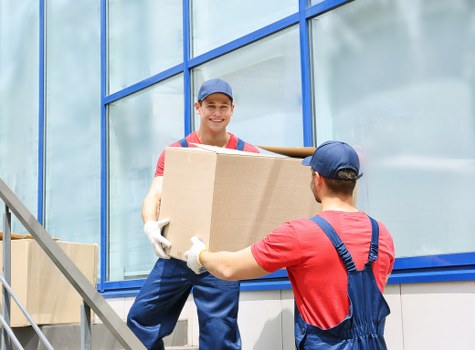 Packed office furniture and boxes ready for transport