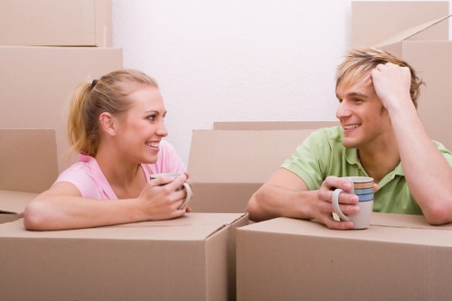 Man and van removals team loading furniture for a Hammersmith local move