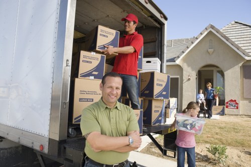 Business furniture and office equipment being packed for a move