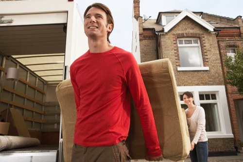 Van removal team handling items on a West London street